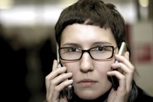 woman-two-smart-phones